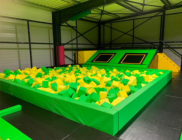 Trampoline park with yellow and green color scheme