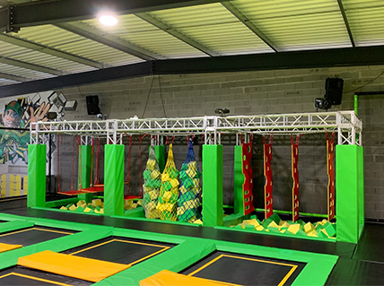 Trampoline park with yellow and green color scheme